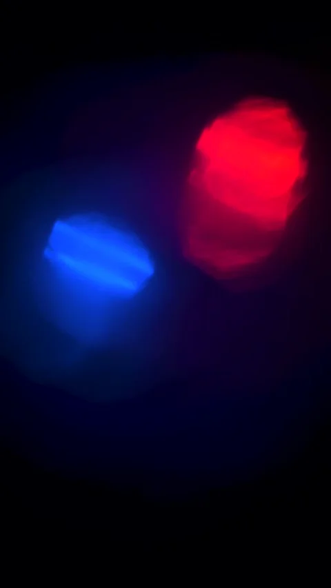 Vertical Cinematic Pulsing Red and Blue Light Leak Background Stock Footage 325768185