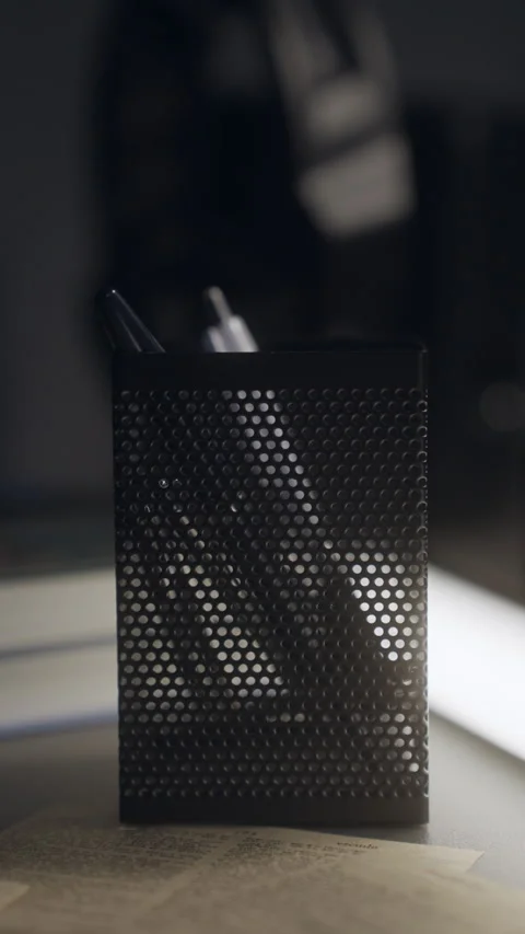 Vertical Cinematic Shot of Hand Picking Up Pen from Desk Holder – 4K Stock Footage 313865447