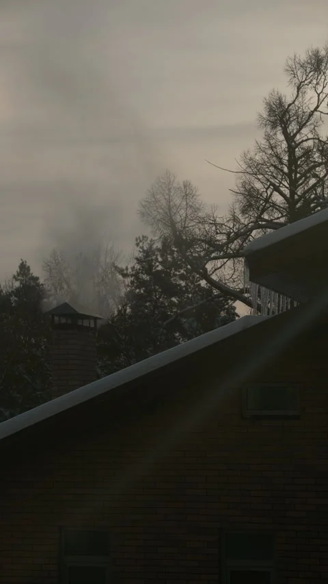 Vertical cinematic showing chimney pipe smoke house during winter Stock-Footage 327615428