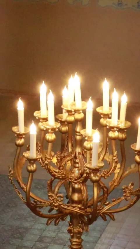 Vertical Cinematic Static Shot of Glowing Floor Candelabra in Synagogue 库存影片 331135938