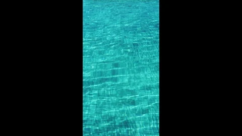 Vertical clear aqua blue swimming pool water texture with gentle ripple waves. Stock Footage 330149709
