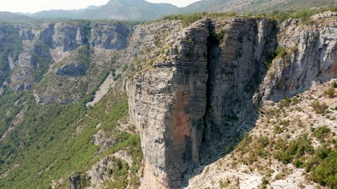 Vertical cliff in a canyon wall. High steep side of a deep ravine Stock Footage 159772823