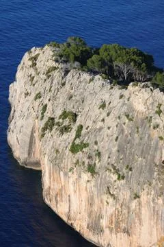 Vertical cliff on the sea Stock Photos