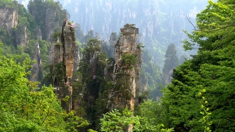 Vertical cliffs in Avatar mountains in Wulingyuan, Zhangjiajie, China. 4K Stock Footage 103430295