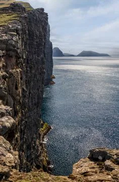 Vertical cliffs over the ocean profile view Stock Photos