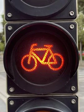 Vertical close up of bicycle traffic light glowing red Stock Photos