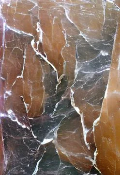 Vertical close-up brown-colored marble stone pattern great match for background Stock Photos