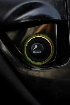 Vertical Close up of the car cigarette lighter socket.modern car interior: Stock Photos