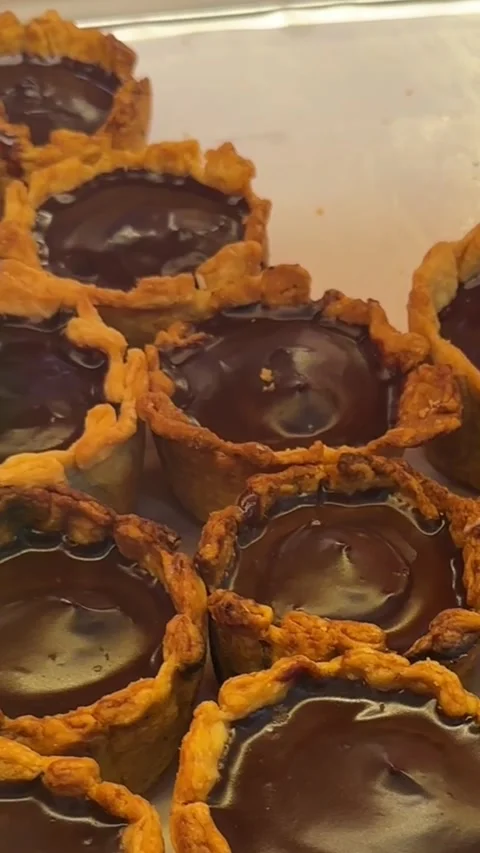 Vertical close up of chocolate and matcha mochi flan dessert Stock Footage 316813125