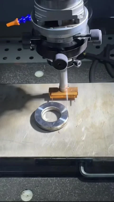 Vertical Close Up CNC Milling Machine Cutting Brass Component with Smoke Video stock 327103876