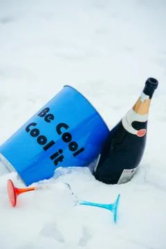 Vertical close-up composition of the blue bucket ''Be Cool. Cool it'', red and Stock Photos