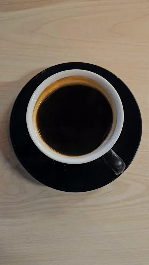 Vertical Close Up of a Cup of Black Coffee/ Americano Stock Footage 327923353
