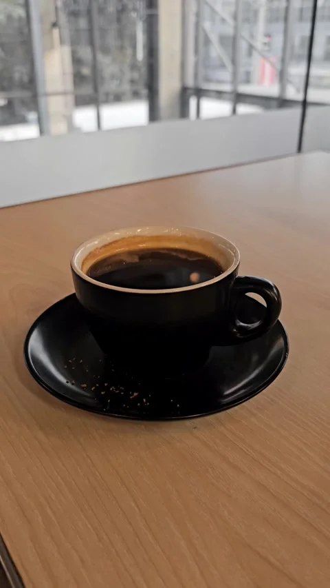 Vertical Close-Up of  a Cup of Black Coffee Stock Footage 327923356