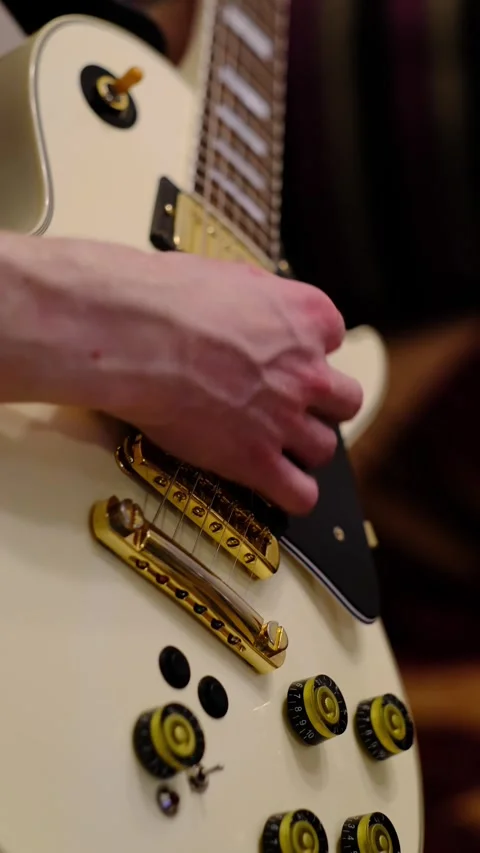 Vertical Close Up of Electric Guitar Bridge and Strings Stock Footage 328602011