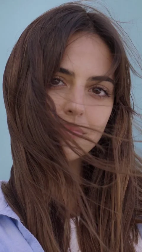 Vertical close up of face. Video on blue background serious and concentrated Stock Footage 239106134