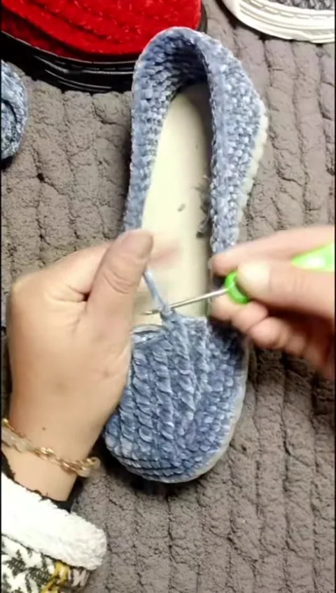 Vertical Close Up Hands Crocheting Blue Velvet Slipper Shoe with Hook (DIY C Stock Footage 327104310