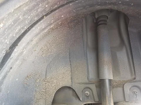 Vertical close up image of slightly rusted worn vehicle brakes Stock Photos