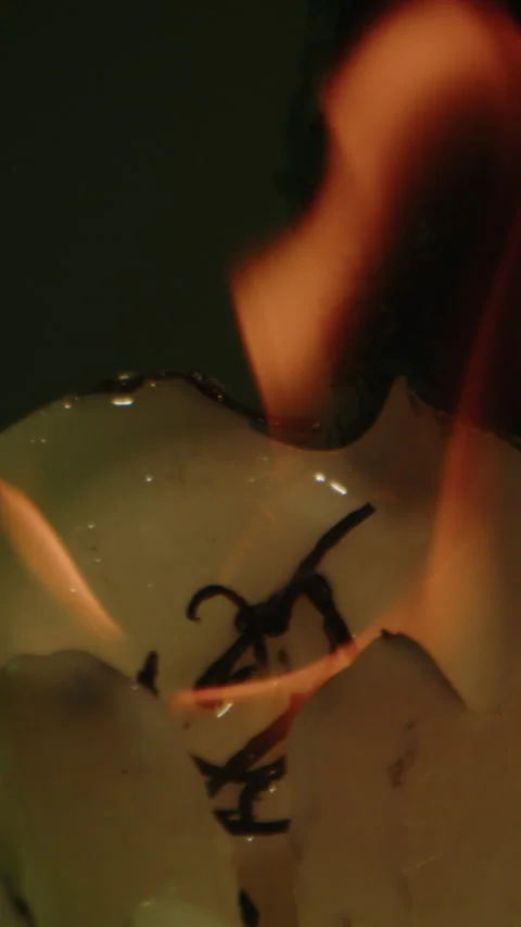Vertical close up of intense flames coming from a large candle at on occult Stock Footage 336374261
