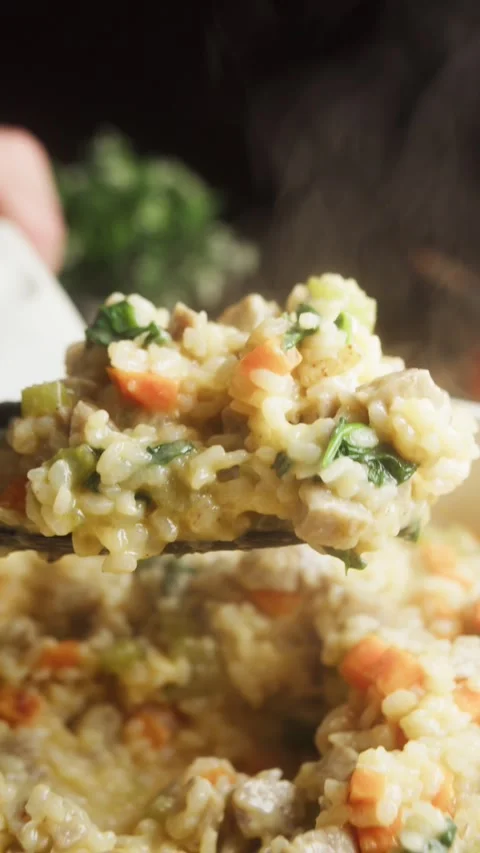 Vertical close-up macro shot of a creamy dairy-free rice with diced sausage Stockbeeldmateriaal 347101931