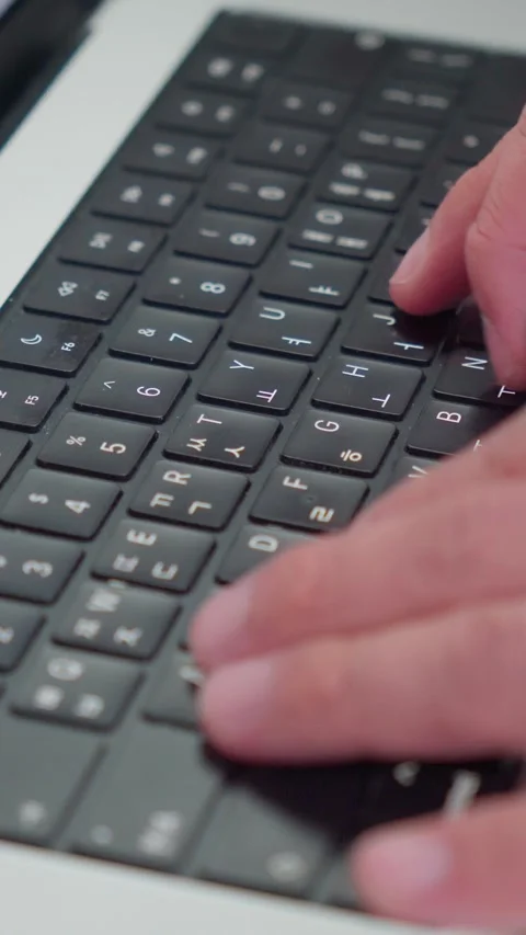 Vertical Close Up Male Hands Typing Text On Laptop 4K Video stock 338368532