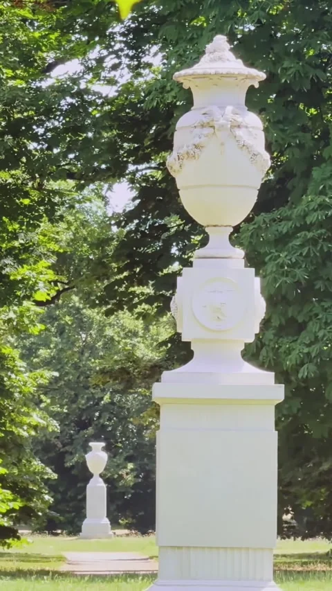 Vertical close-up of a monumental Carrara marble garden vase in Parco Ducale Stock Footage 346310617