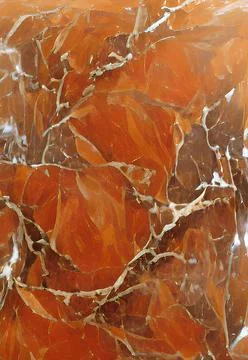 Vertical close-up orange-colored marble stone pattern great match for background Stock Photos