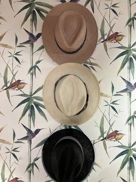 Vertical close up of panama hats on patterned background Stock Photos
