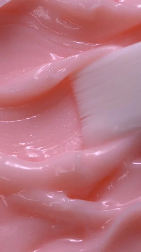 Vertical close-up pink smooth skin cream texture, beauty facial cosmetics mask 動画素材 287416179