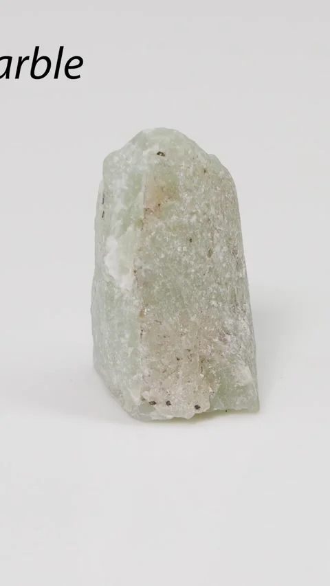 Vertical Close Up of Rotating Green Serpentine Marble Rock Specimen Stock Footage 327768105