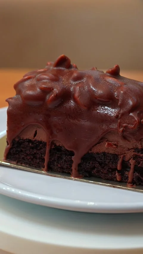 Vertical Close Up Rotating Rectangular Chocolate Cake Single Portion Stock Footage 332182638