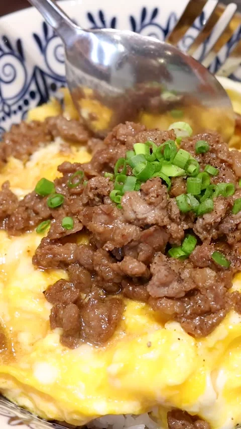 Vertical Close-up of Scooping Thai Beef and Fluffy Omelette Rice Stock Footage 329097328
