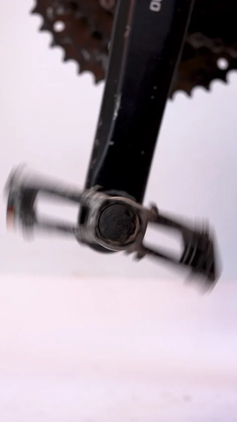 Vertical close-up of a scratched and dirty black metal bicycle pedal spinni.. Stock Footage 310255907