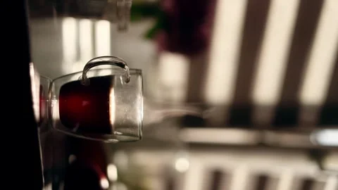 Vertical close up shot with cup of hot coffee or tea and beautiful sun at home Stock Footage 246556770