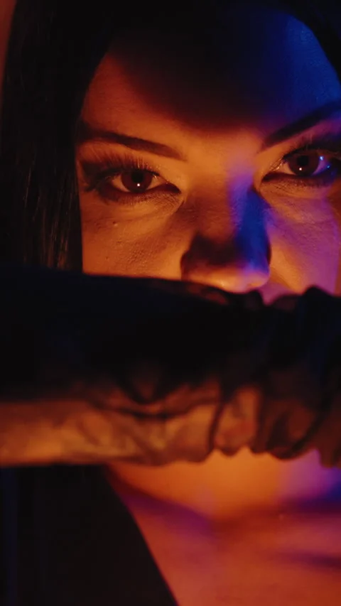 Vertical close-up shot of a model witch woman, with dark makeup and dressed in a Stock Footage 292607593