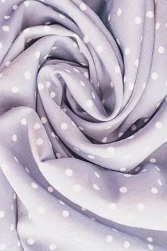 Vertical close up shot of a soft lavender purple polka dot fabric material .. Stock Photos