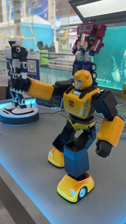 Vertical Close-Up Shot of a Yellow Bumblebee Interactive Robot Displayed at an Stock Footage 345648056