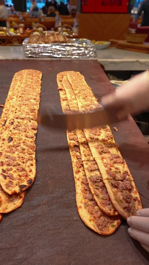 Vertical Close Up Slicing Freshly Baked Turkish Etli Ekmek Meat Bread Stock Footage 332654074