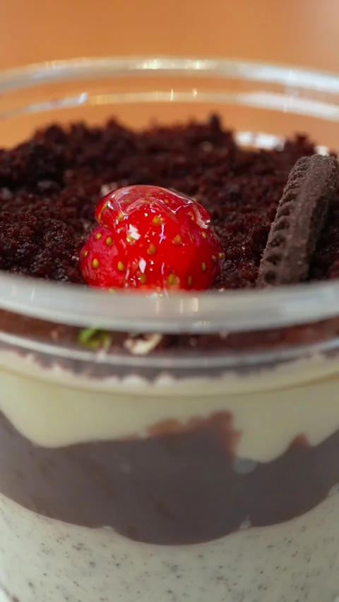 Vertical Close Up of Strawberry and Biscuit Dessert Spinning on Rotating Stan Stock Footage 332471928