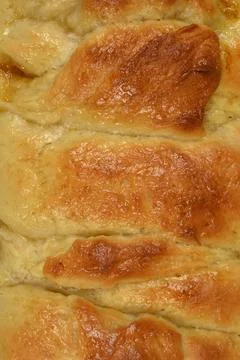 Vertical close-up texture of baked brioche bread Stock Photos