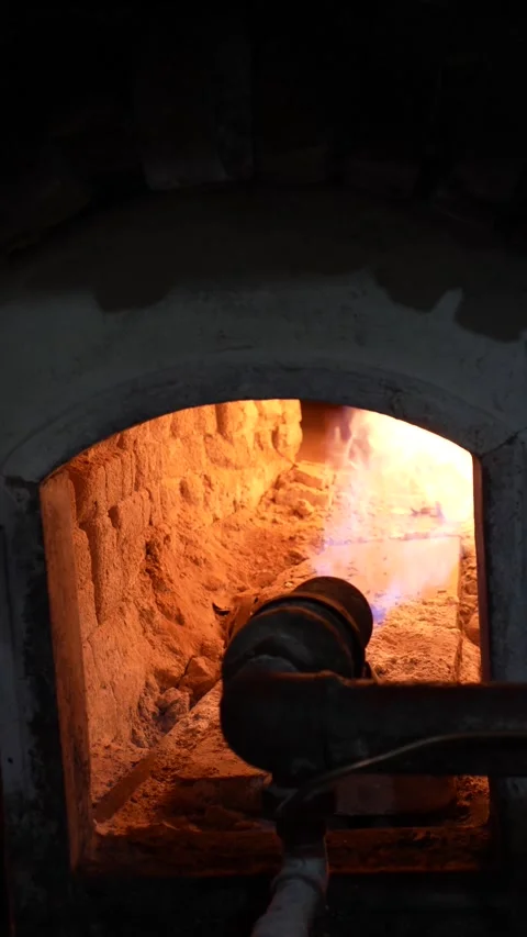 Vertical close-up of a traditional masonry bakery oven with gas burner and glowi Stock-Footage 345375678