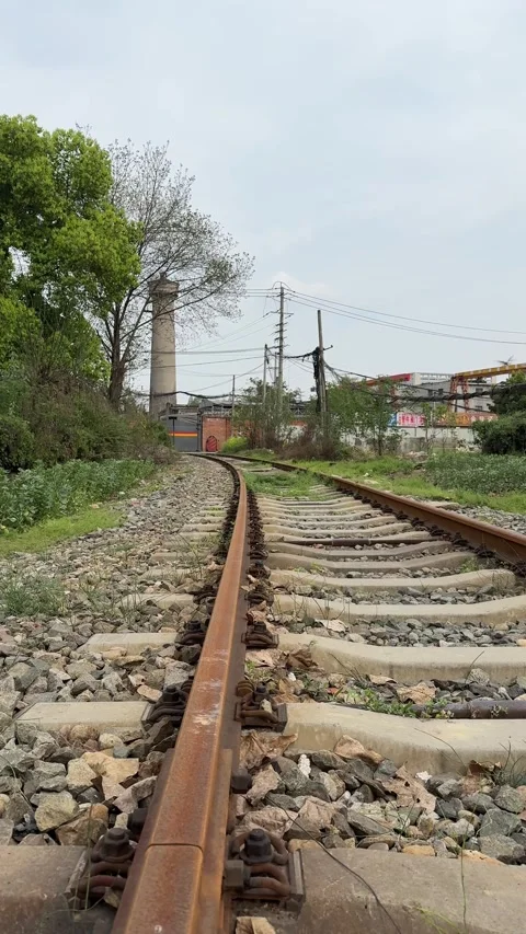 Vertical Close up of train tracks and sleepers in Chinese countryside Stock Footage 334700698