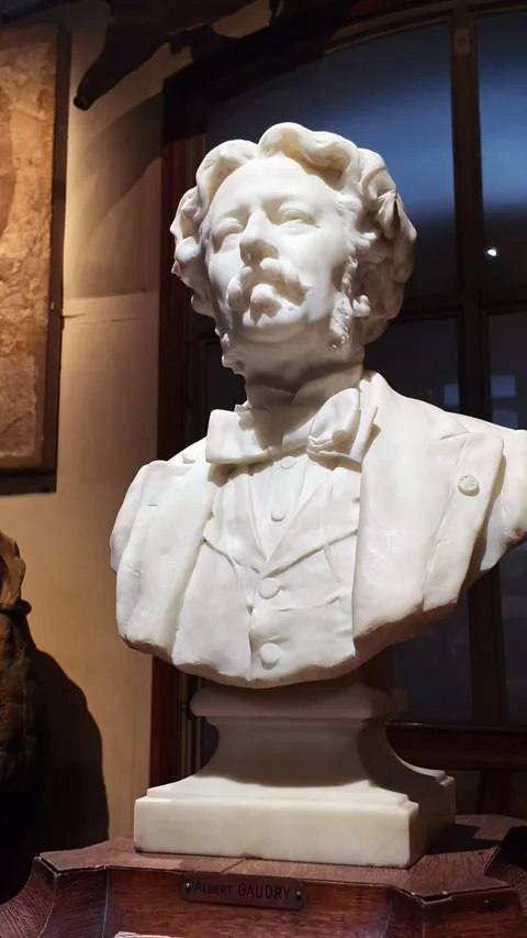 Vertical close-up view about the white marble statue of Albert Gaudry in Stock Footage 303897941