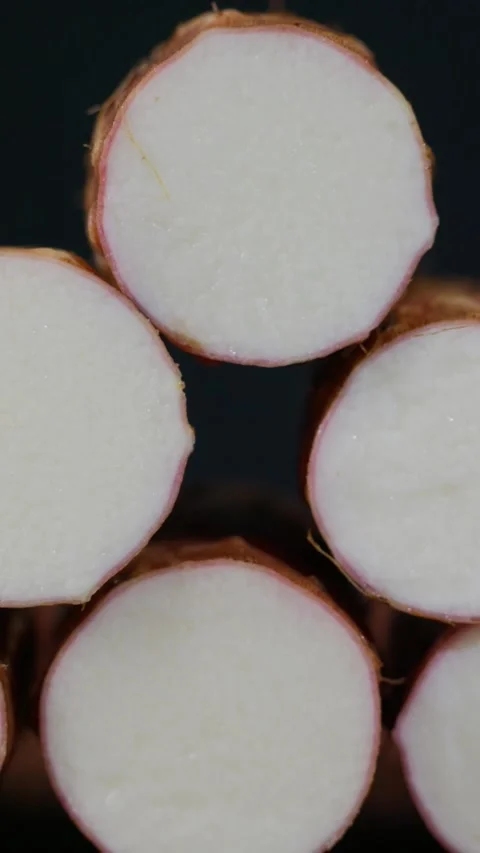 Vertical: A close-up view of the cross-section of a yam. Stock Footage 341836894