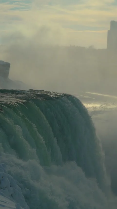 Vertical close view of Horseshoe Falls from the American side in winter Stock-Footage 342331090