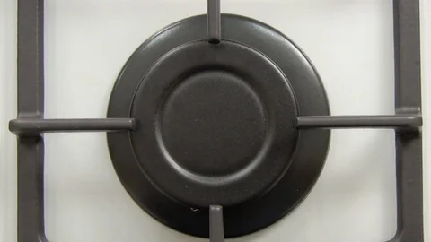 Vertical close view natural gas ignition in stove burner. Stock Footage 84789500