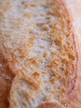 Vertical close-up view reveals crispy crust and soft, airy interior of fres.. Stock Photos