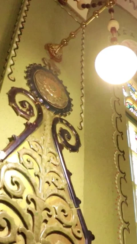 Vertical Close-up of Vintage Hanging Light Bulb in Historic Synagogue Stock-Footage 330368356