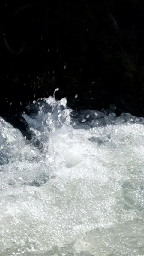 Vertical close up of water splashing from a cascade Video stock 336797633