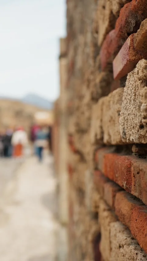 Vertical close-up of weathered Pompeii brick masonry with shallow depth of Stock Footage 335923807