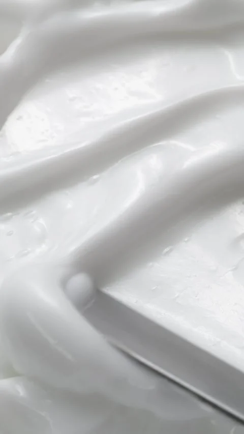 Vertical close-up white smooth skin cream texture, beauty facial cosmetics mask 動画素材 281315799